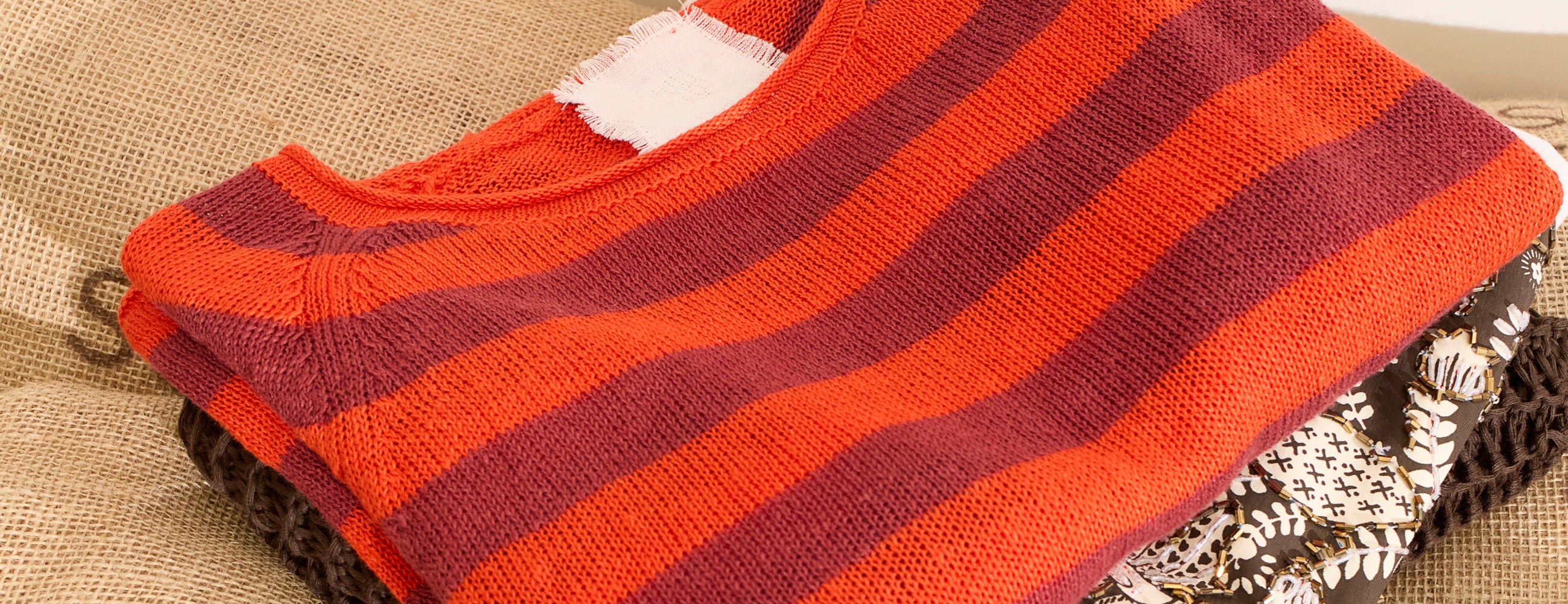 Folded knits & dresses by Oui clothing.