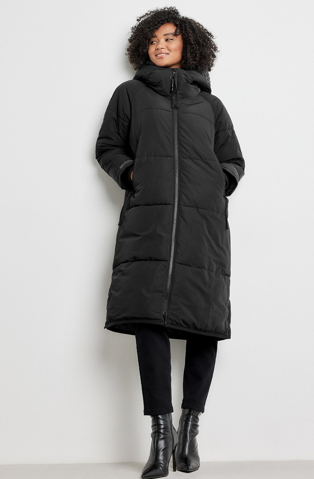 Explore Black Puffer Coat with Safety Details